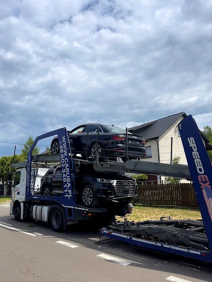 Car transporter carrying two Audis on its decks