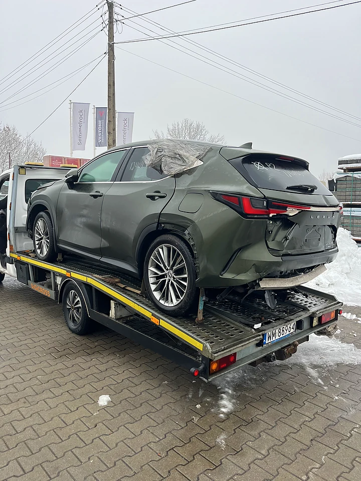 Green Lexus on a trailer