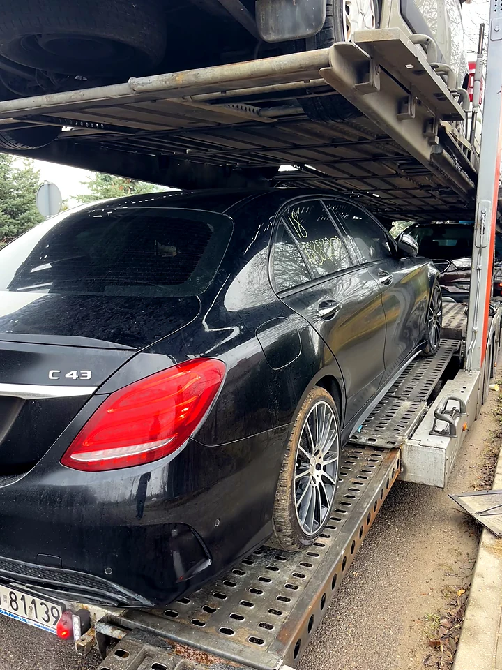 Black Mercedes C43 AMG on a car transporter