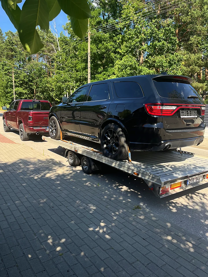Black Dodge Durango on a trailer